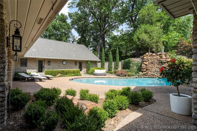 view of pool featuring a patio area