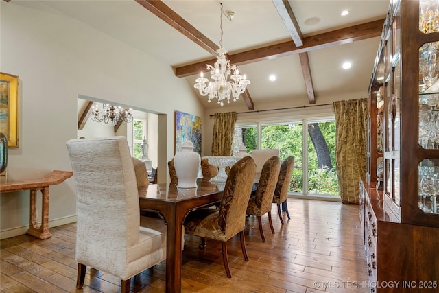 dining area featuring hardwood / wood-style flooring, a chandelier, and vaulted ceiling with beams