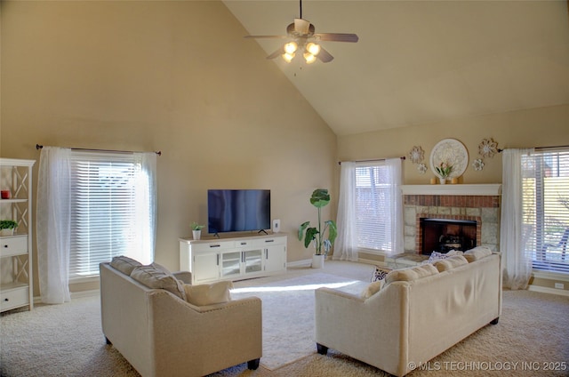 carpeted living room featuring ceiling fan, plenty of natural light, and high vaulted ceiling