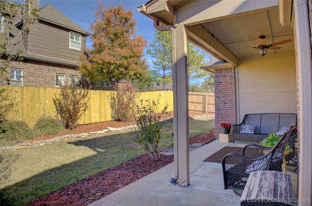 view of patio / terrace featuring ceiling fan and an outdoor living space