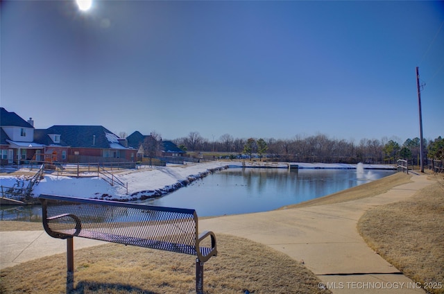 view of pool with a water view