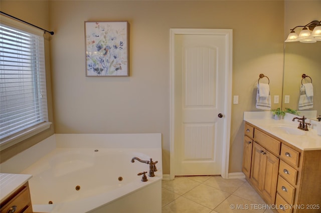 bathroom featuring a bathtub, tile patterned floors, and vanity