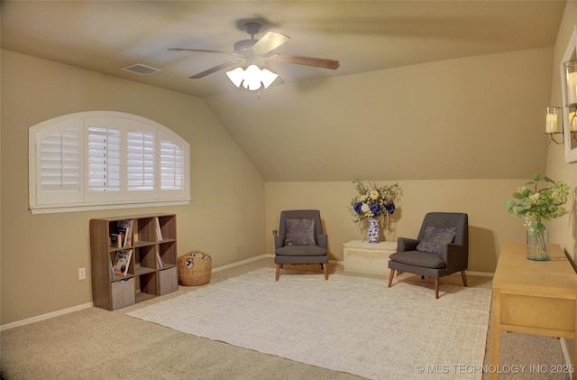 sitting room featuring ceiling fan, lofted ceiling, and carpet floors