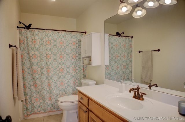 bathroom featuring toilet, tile patterned flooring, and vanity