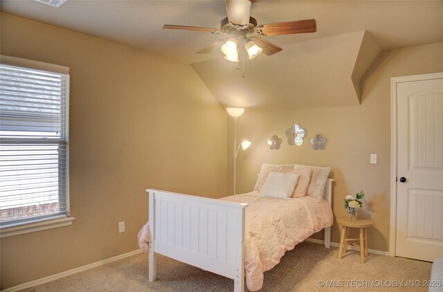 carpeted bedroom with ceiling fan and multiple windows