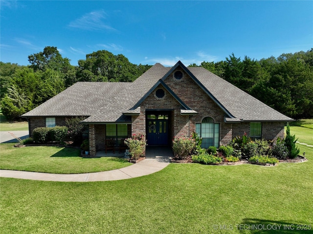 view of front of property featuring french doors and a front yard