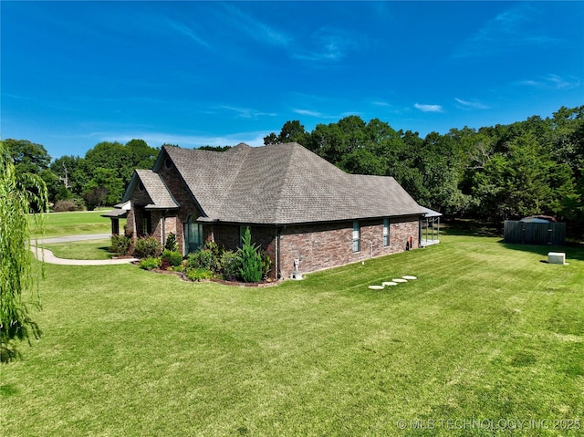 view of property exterior with a lawn