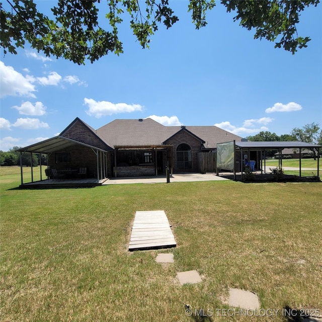 view of community featuring a yard and a patio