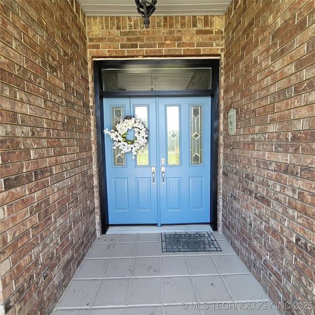 view of exterior entry featuring french doors