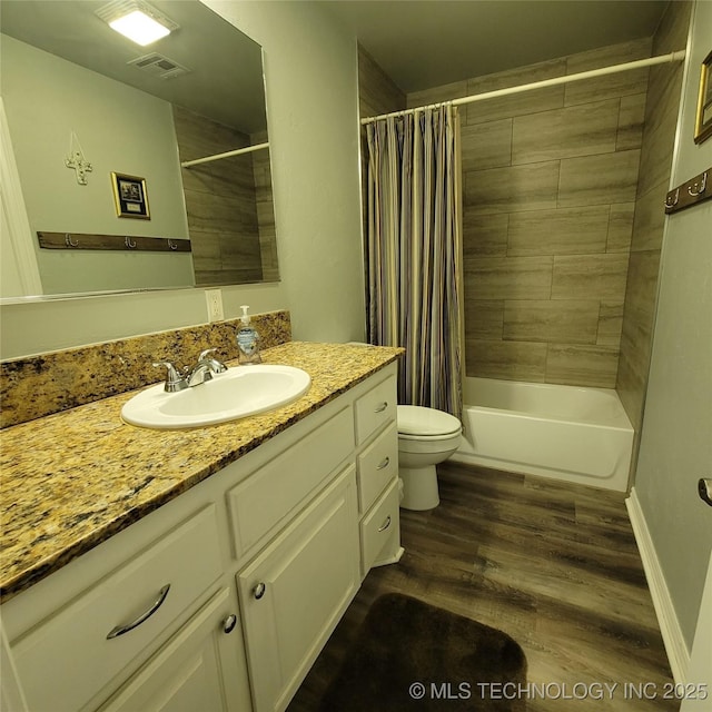 full bathroom featuring toilet, vanity, shower / bath combo with shower curtain, and hardwood / wood-style flooring