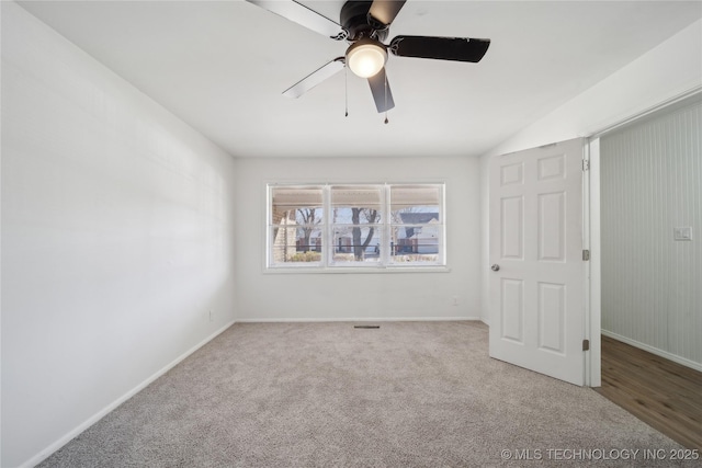 spare room featuring carpet floors and ceiling fan