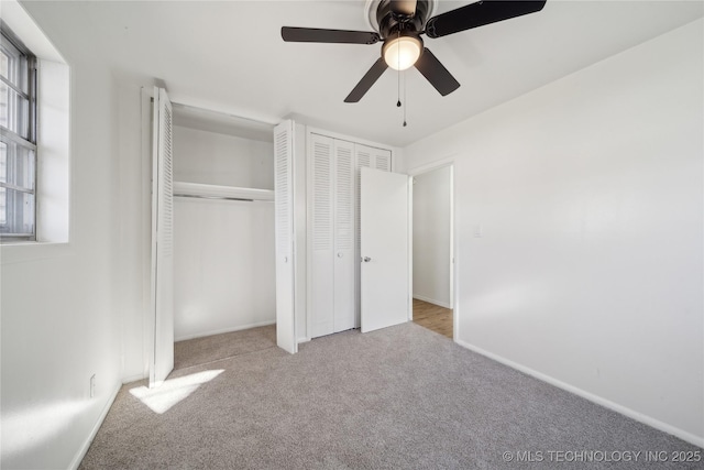 unfurnished bedroom with ceiling fan and light carpet