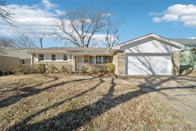 single story home featuring a front lawn and a garage