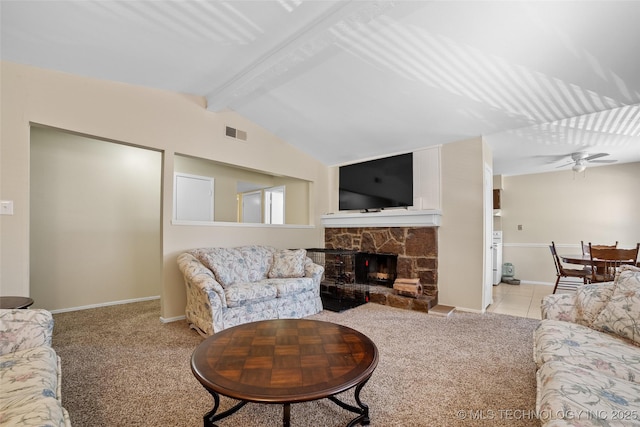 living room featuring ceiling fan, a fireplace, light colored carpet, and lofted ceiling with beams