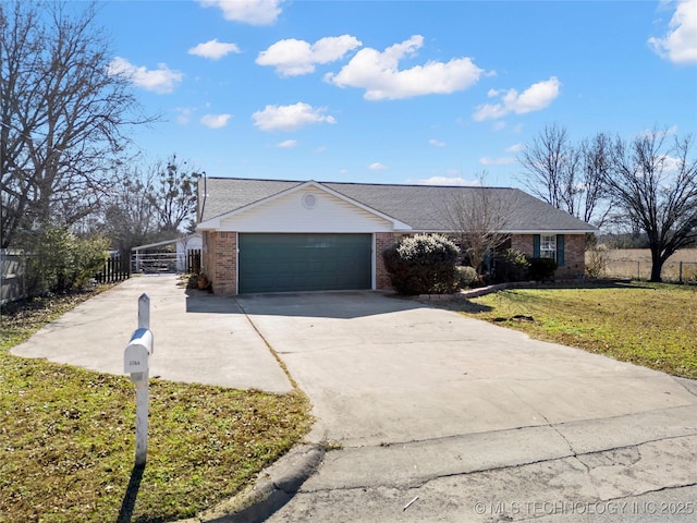 single story home with a garage and a front yard