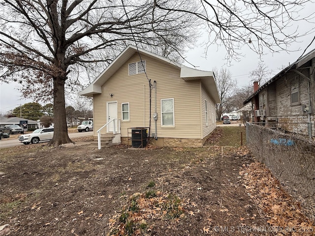 back of property featuring central air condition unit