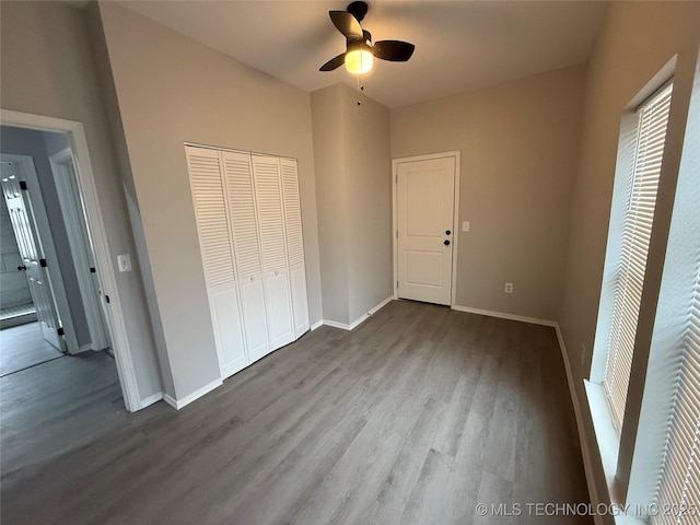 unfurnished bedroom featuring light hardwood / wood-style floors, a closet, and ceiling fan