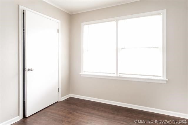 unfurnished room featuring dark wood-type flooring