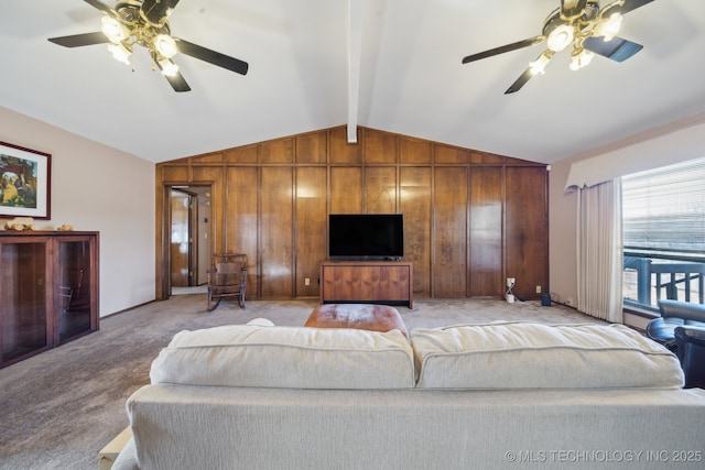 living room with light carpet, wooden walls, lofted ceiling with beams, and ceiling fan