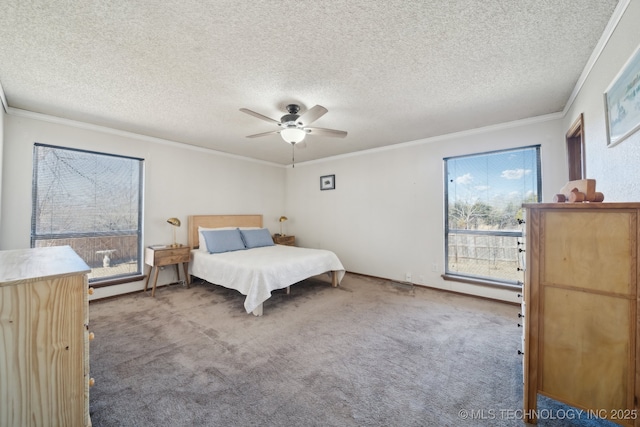 carpeted bedroom featuring a textured ceiling, ornamental molding, and ceiling fan