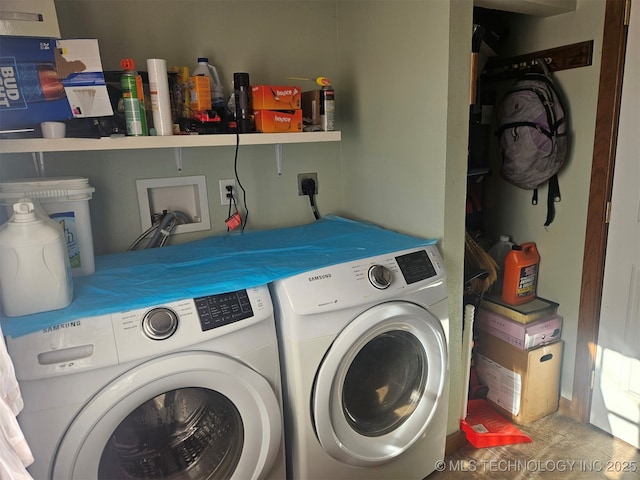 washroom featuring washer and clothes dryer