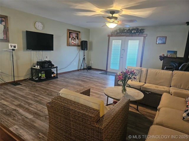 living room with ceiling fan and wood-type flooring