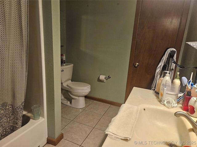 bathroom with shower / tub combo, tile patterned floors, and toilet