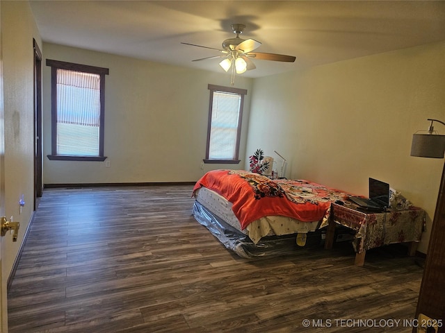 bedroom featuring dark wood-type flooring and ceiling fan