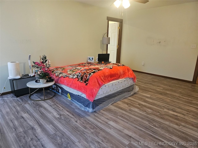 bedroom featuring wood-type flooring and ceiling fan