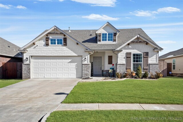 view of front of home with a garage and a front yard