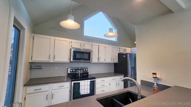 kitchen with pendant lighting, decorative backsplash, sink, white cabinetry, and stainless steel appliances