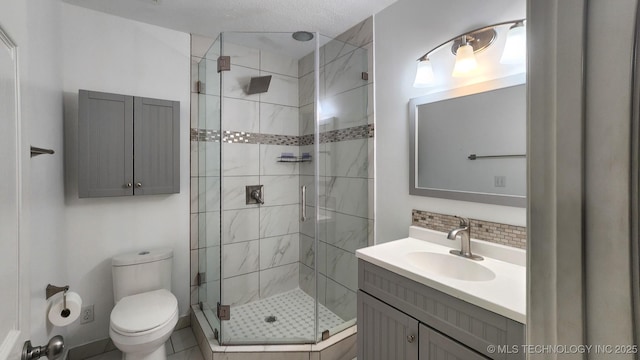 bathroom featuring a shower with shower door, backsplash, toilet, and vanity