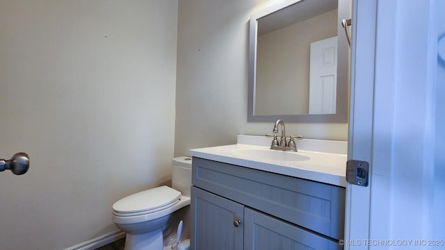 bathroom with toilet and vanity