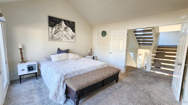 bedroom featuring vaulted ceiling and carpet flooring