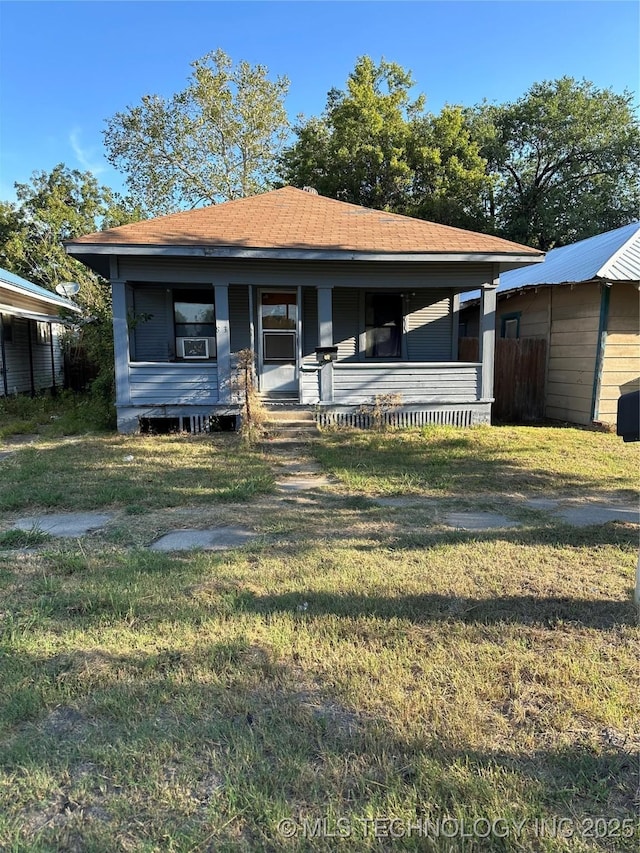 view of front of home featuring a front yard and a porch