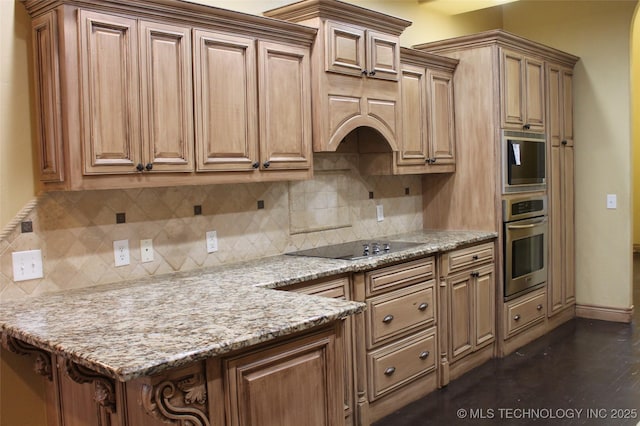 kitchen featuring light stone countertops, backsplash, black electric cooktop, and stainless steel oven