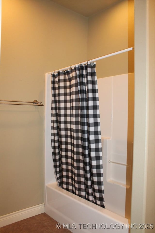 bathroom with tile patterned flooring and shower / bath combination with curtain