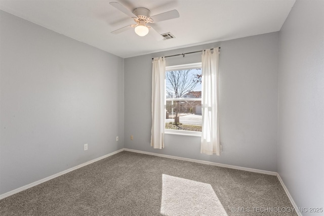 carpeted empty room featuring ceiling fan