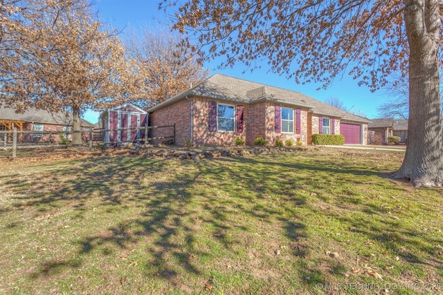 view of front of house with a front lawn and a garage