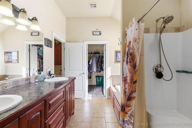 bathroom with tile patterned flooring, vanity, and curtained shower