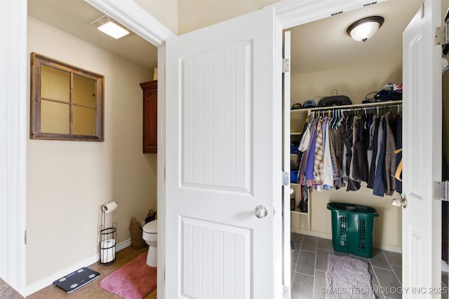 bathroom featuring tile patterned floors and toilet