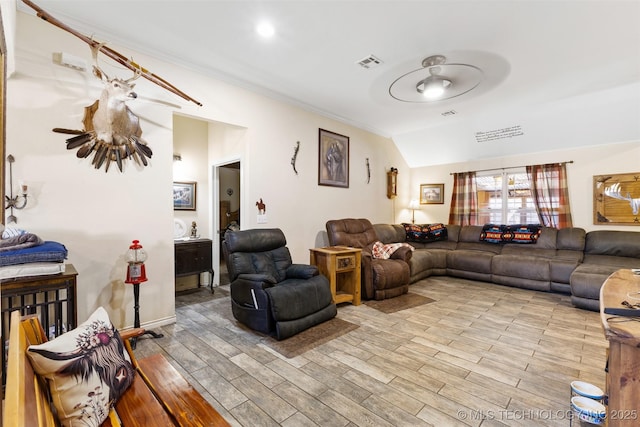 living room featuring vaulted ceiling