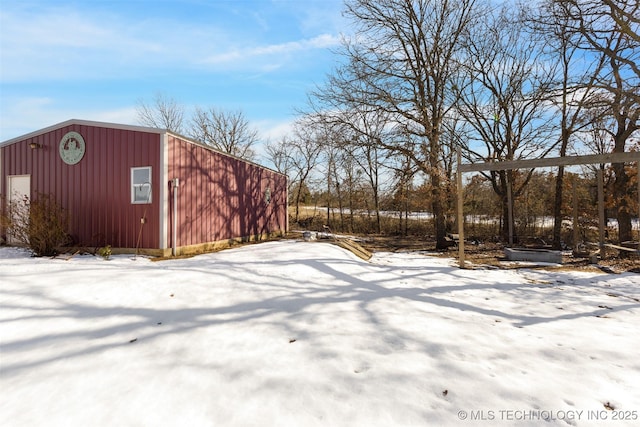 snowy yard with an outdoor structure