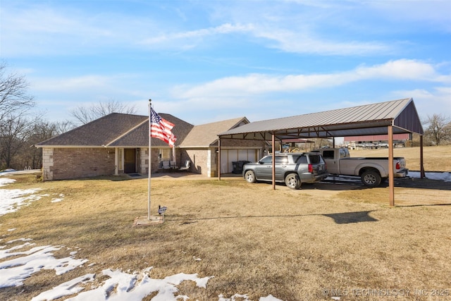 exterior space with a yard and a carport