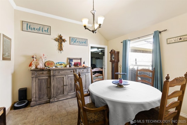 dining area featuring ceiling fan with notable chandelier and vaulted ceiling