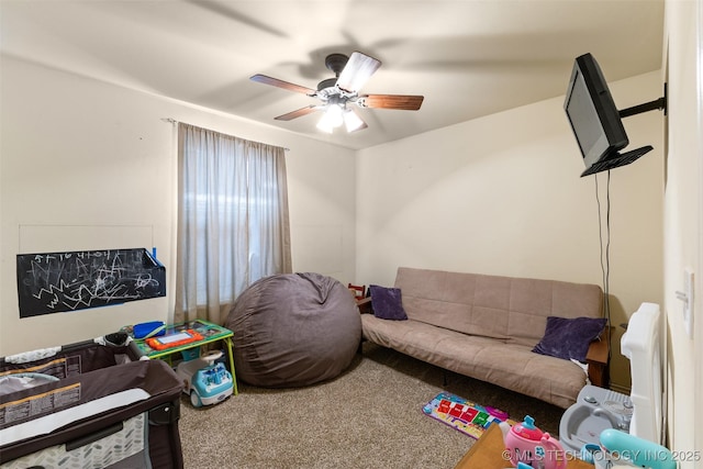 interior space featuring ceiling fan and carpet flooring