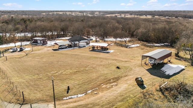 birds eye view of property with a rural view