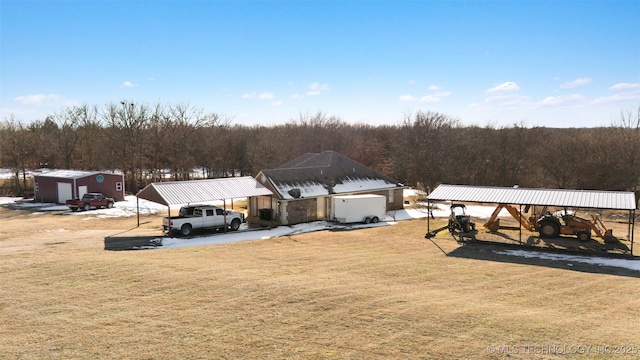 view of yard featuring an outbuilding and a carport