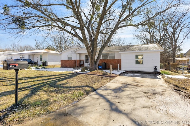 ranch-style house with a front lawn