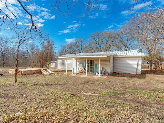 back of house with a yard